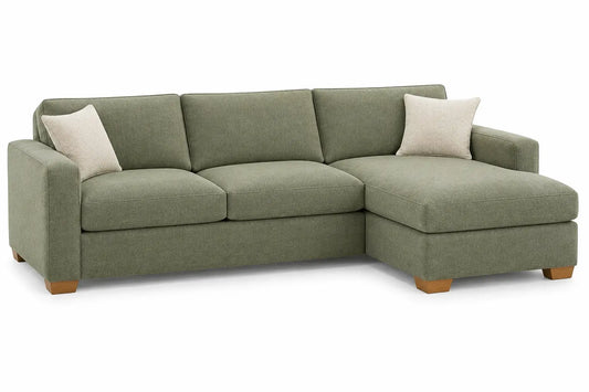 Green figuredcherry corner sofa with elevated legs, upholstered in fabric, designed for comfortable seating in living rooms.